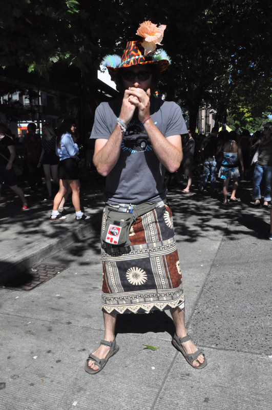 This fancy-hatted man played harmonica up and down Pike during the festival.