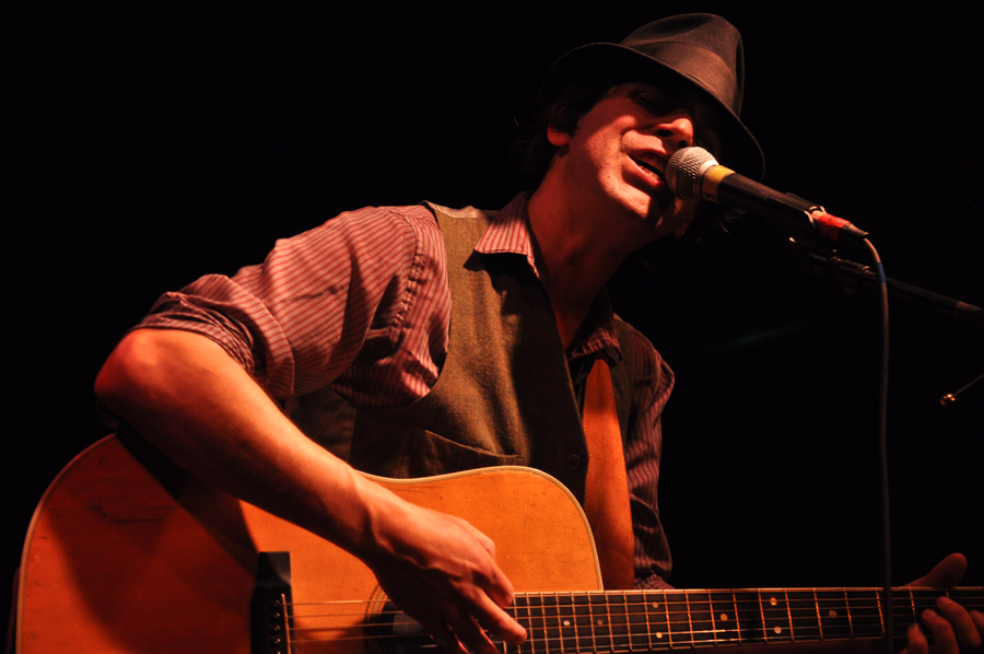 His passionate vocals and sneer win Slim the lady's admiration and the men's envy.