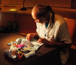 Mark Kremen, of the Skokomish tribe, does bead work in the Ron Hilbert Gallery at the Chief Seattle Club.