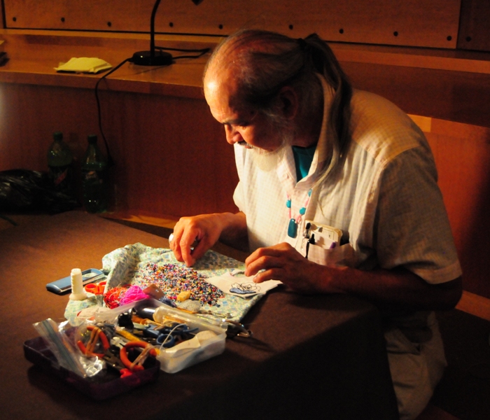 Mark Kremen, of the Skokomish tribe, does bead work in the Ron Hilbert Gallery at the Chief Seattle Club.