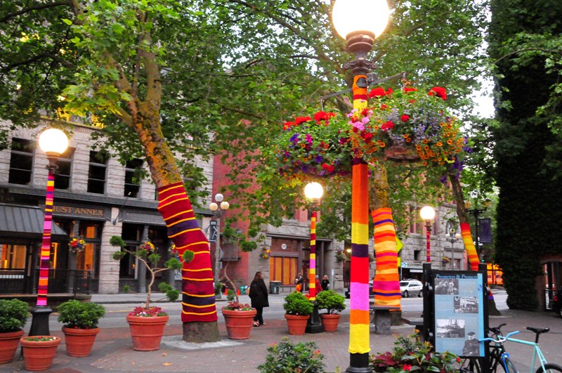 Suzanne Tidwell has yarn-bombed the trees and light poles in Occidental Park as part of the summer art installation.
