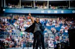 Lenny Kravitz hails a roaring crowd at Qwest Field.