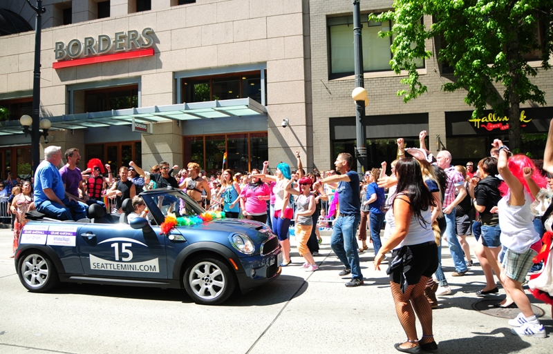 Parade marshalls Armistead Maupin and Egan Orion  were riding along when Egan jumped out and led a flash mob...