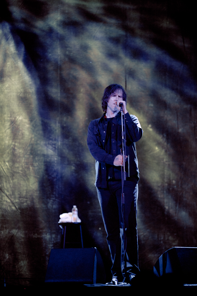 Moody lighting matches Lanegan's dark voice.