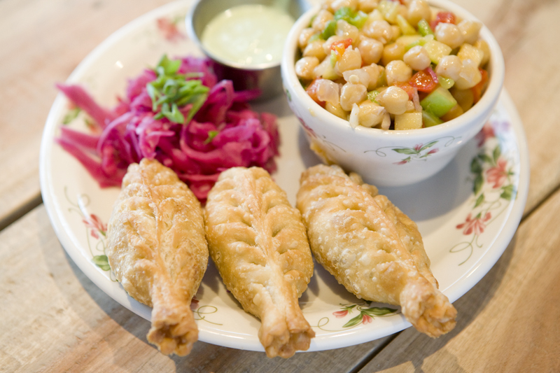 SAMO - Fried Tibetan Flaky Dumplingsneuwaukum potato, english peas, and yellow curry.