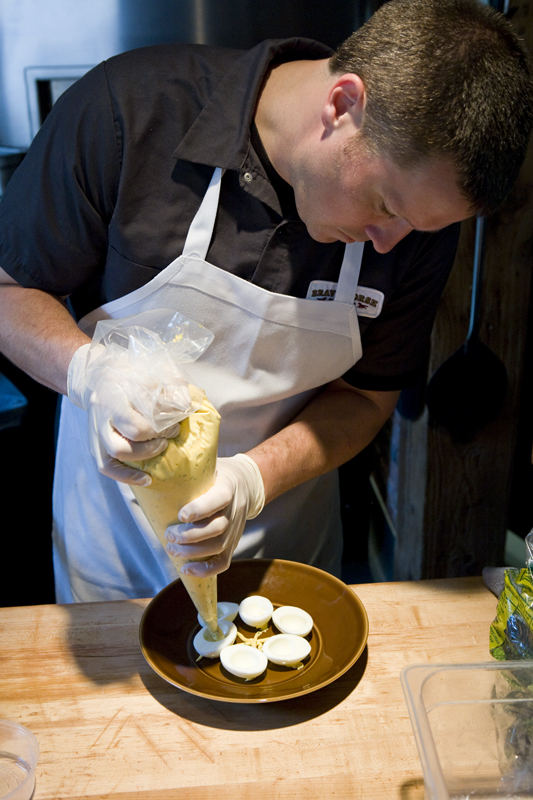 Head Chef of Brave Horse Tavern, Brian Walceyk making the devilled eggs.