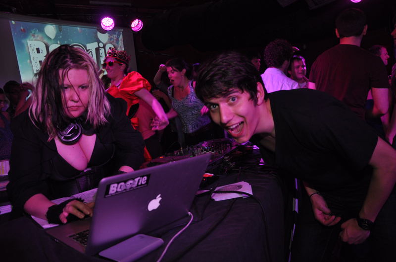 Mysterious D pumps the jams while an audience member dances on.