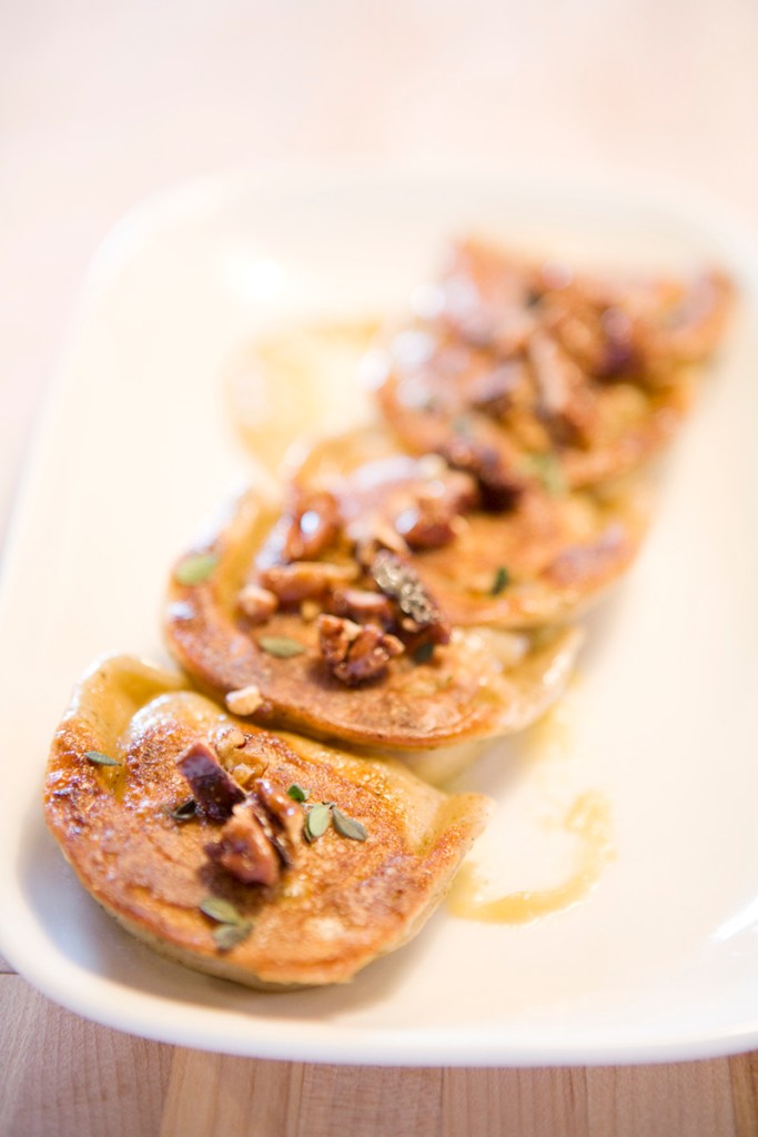 Dumplings with earl grey ricotta, golden raisin, and pecan.