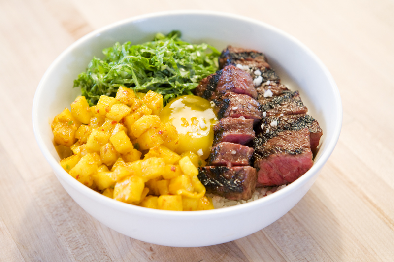 Rice with egg yolk, short rib, sambal daikon, and mustard green.