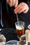 Bartender Bennett Barr showing the steps to making a tasty Manhattan.