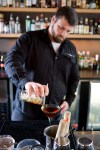 Bartender Bennett Barr showing the steps to making a tasty Manhattan.
