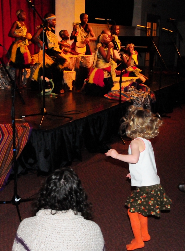 This little girl couldn't resist jumping to the sound of the drums.