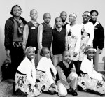 The choir with teacher Alice Nambasa and choir director Betty Amorgin.