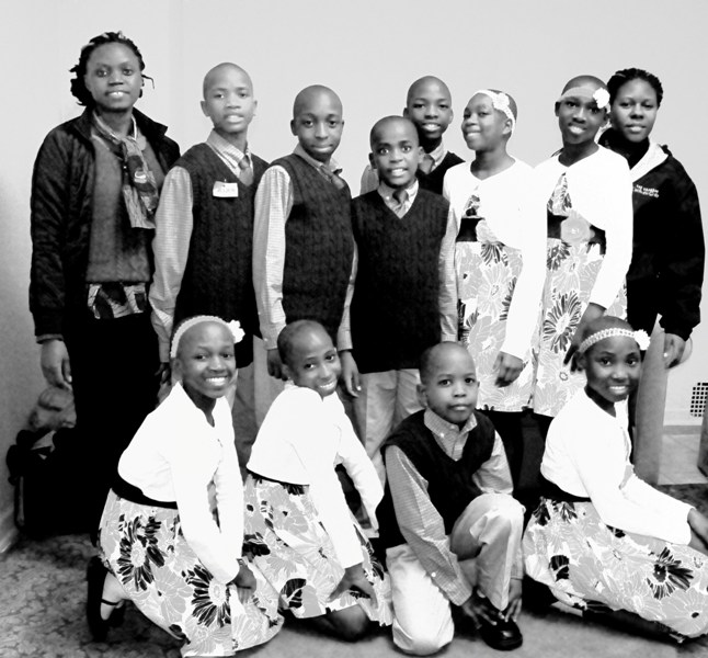 The choir with teacher Alice Nambasa and choir director Betty Amorgin.