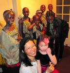 Audience members pose backstage with the choir.