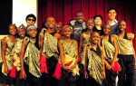 The choir with Langston Hughes Performing Arts Center's  Royal Alley-Barnes and Jackie Moscou.