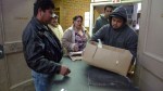 Volunteers distribute food to the needy among EllensburgaE™s Hispanic population at the APOYO food bank on the campus of Central Washington University.