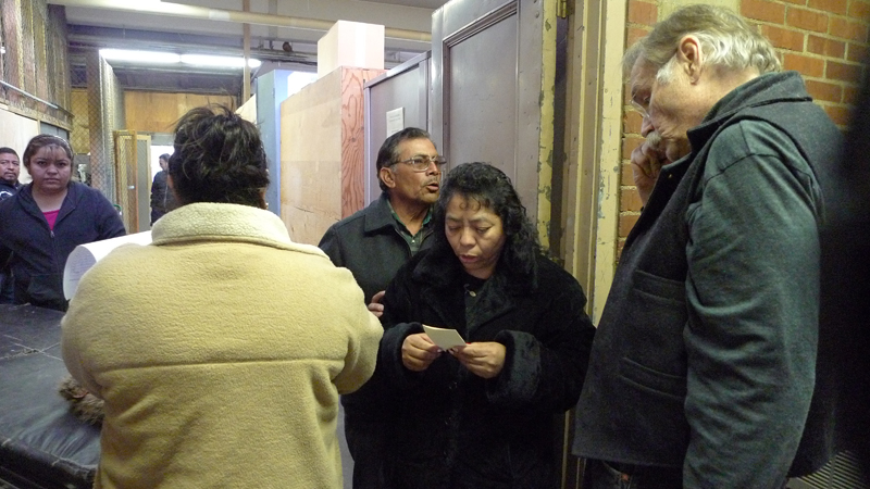 APOYO founder Phillip Garrison chats with a couple from Royal City, Washington.