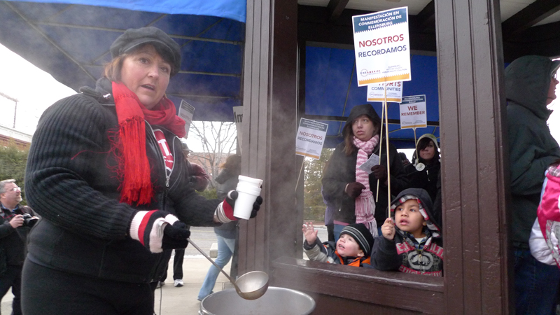 Julia Karns serves up hot chocolate during the protest, held on a bitterly cold Saturday afternoon.