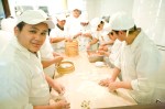 Making dumplings: a team effort.