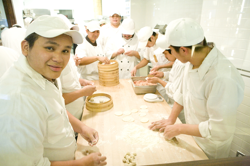 Making dumplings: a team effort.