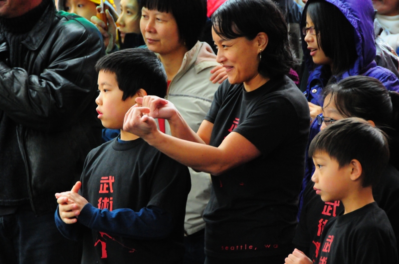 A martial arts instructor gives encouragement.