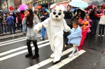 A rabbit leads the children's costume parade.
