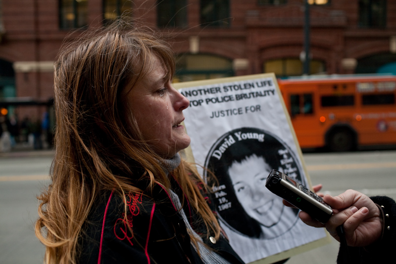 About a dozen protesters gathered today at the King County Courthouse in