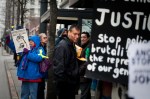 About a dozen protesters gathered today at the King County Courthouse in