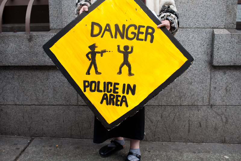 About a dozen protesters gathered today at the King County Courthouse in