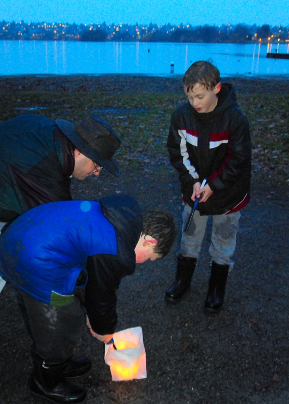 Cub Scout pack 321 lights luminarias near the Green Lake Community Center.