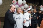 Salvation Army Lt. Colonel Doug O'Brien shakes hands with Seahawks coach Pete Carroll.