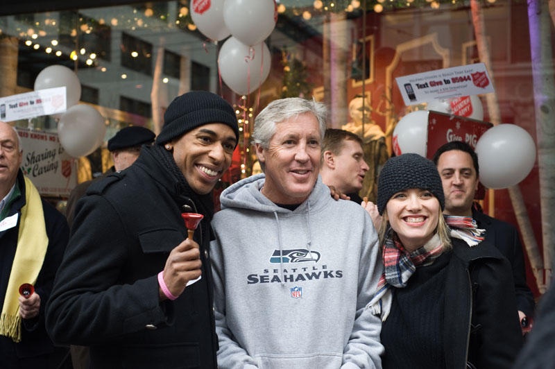 Pete Carroll poses with fans.