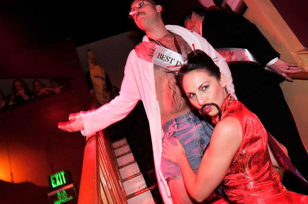 Miss Movember 2010 Natalie Childers of Seattle poses with the Man of Movember Jeremy Malik of San Diego during the 2010 Movember Seattle Gala Parte at Triniity on Saturday evening Nov. 27, 2010, in Pioneer Square in downtown Seattle. Movember is a charity event that originated in Australia in 2003 and is growing exponentially throughout the world. As part of the fundraising challenge, men grow a mustache beginning November 1st to help raise funds for prostate and testicular cancer research. The funds go to the Livestrong Foundation and also for prostate cancer research.