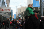 Many of the younger parade attendees watched the action from their parents' shoulders.