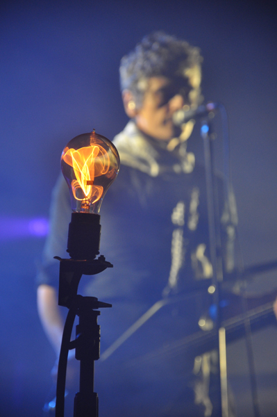 Amedo Pace, in the background, plays in the band with his twin brother, Simone, who's on drums.
