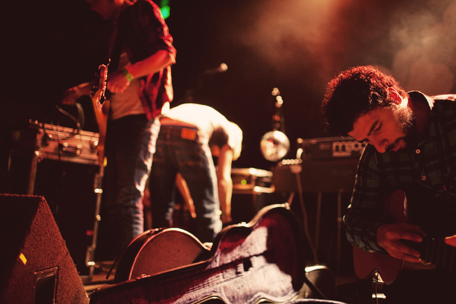 JosAc GonzA¡lez, frontman of Sweden-based band Junip, tunes his guitar before the band's set.