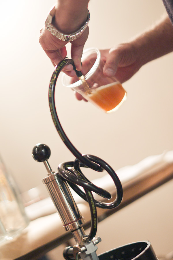 Kelly prepares beer for SPROUT guests.