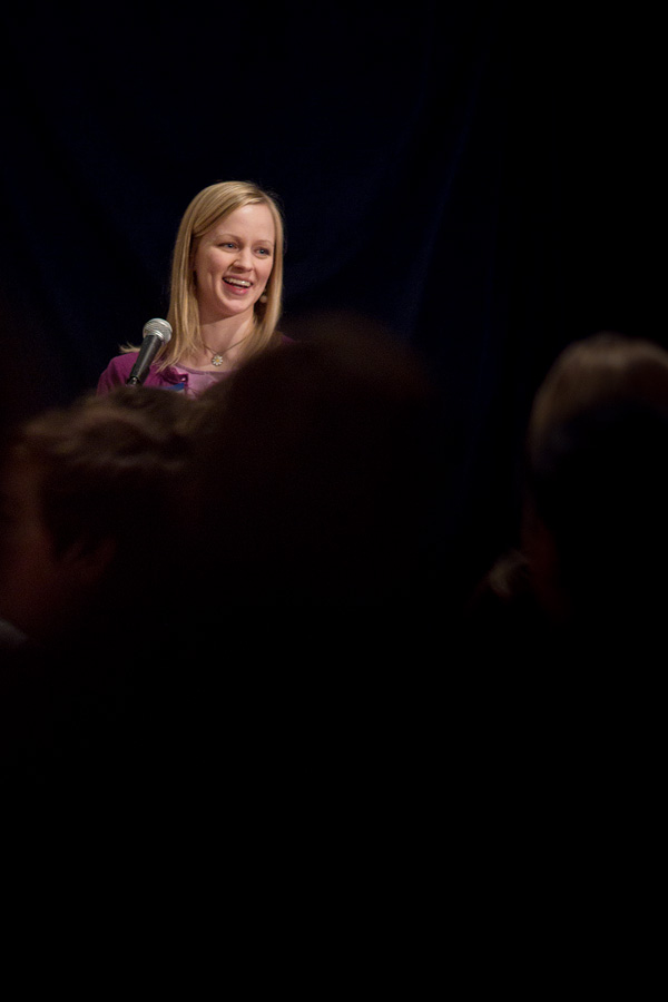 Whitney Aguirre, who received $1000 at the last SPROUT dinner, explains her art project to the guests at the Fremont Abbey Arts Center.