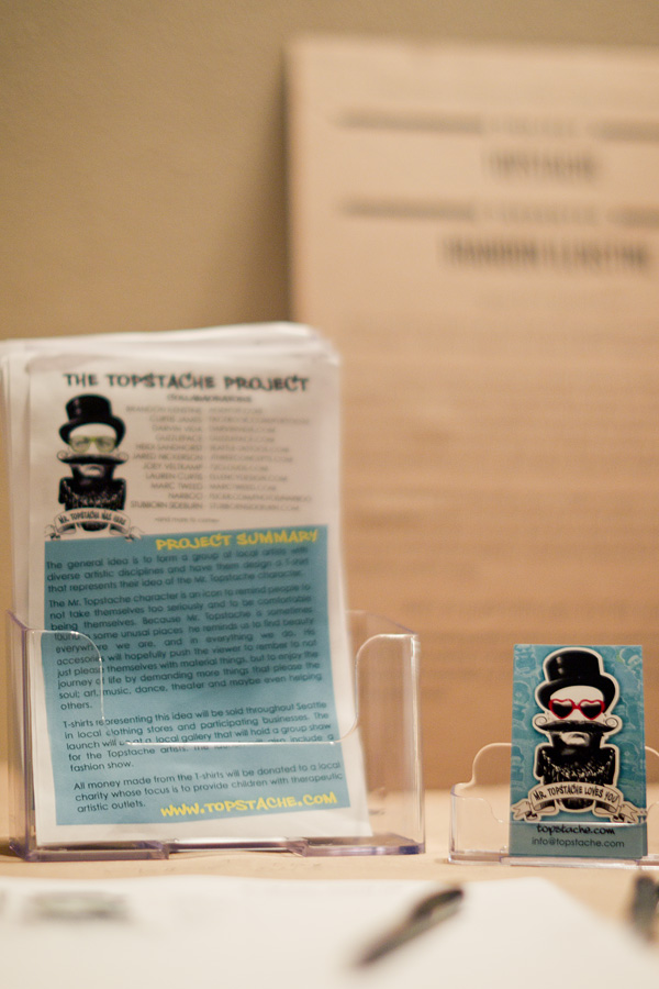 An explanation of Mr. Topstache, a project by Brandon Ilenstine, sits on a table during SPROUT. Mr. Topstache is a fictional character used to help people not take life so seriously.