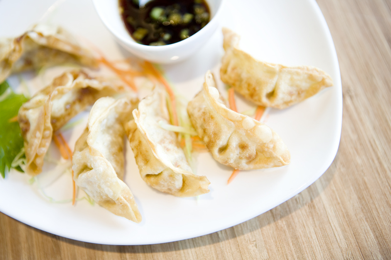 Japanese Gyoza Chicken & Vegetables dumplings pan aE“ fried in the classic tradition, served with vinaigrette soy sauce.