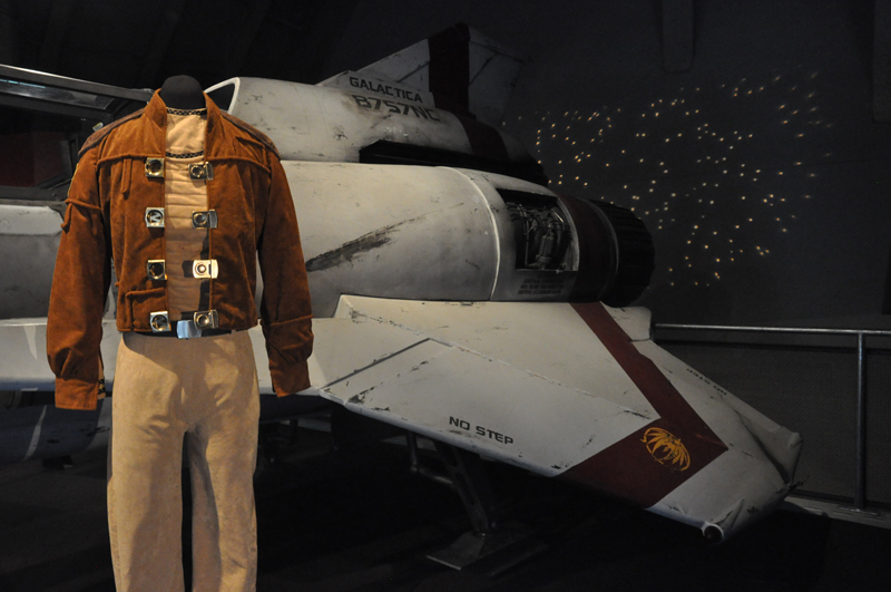A fighter costume in front of a life-sized Viper Mark II spacecraft
