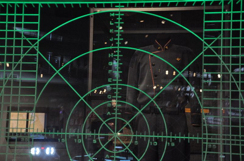 Commander William Adama's duty blues uniform can be seen through the laser screen.