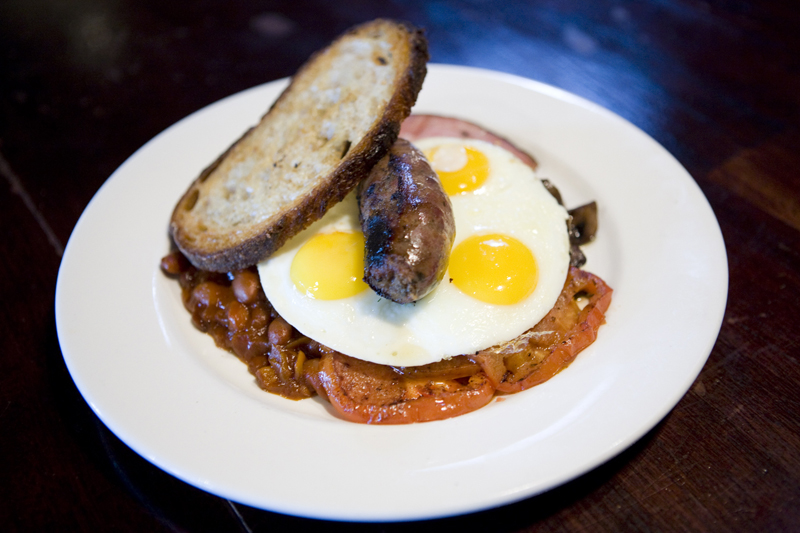 Full English Breakfast (three eggs fried, ham, baked tomato, sausage, baked beans, & fry bread).