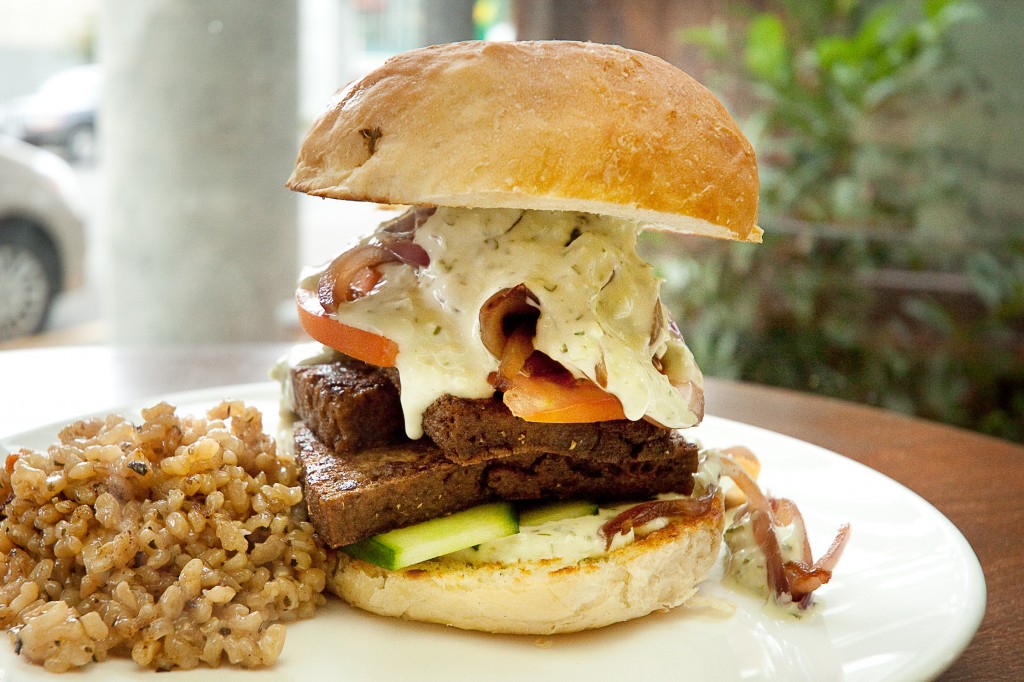 aEœEl Besito CalienteaE burger: grilled tofustrami on a patella bun with caramelized onions and vegan lime-jalapeA±o mayonnaise.