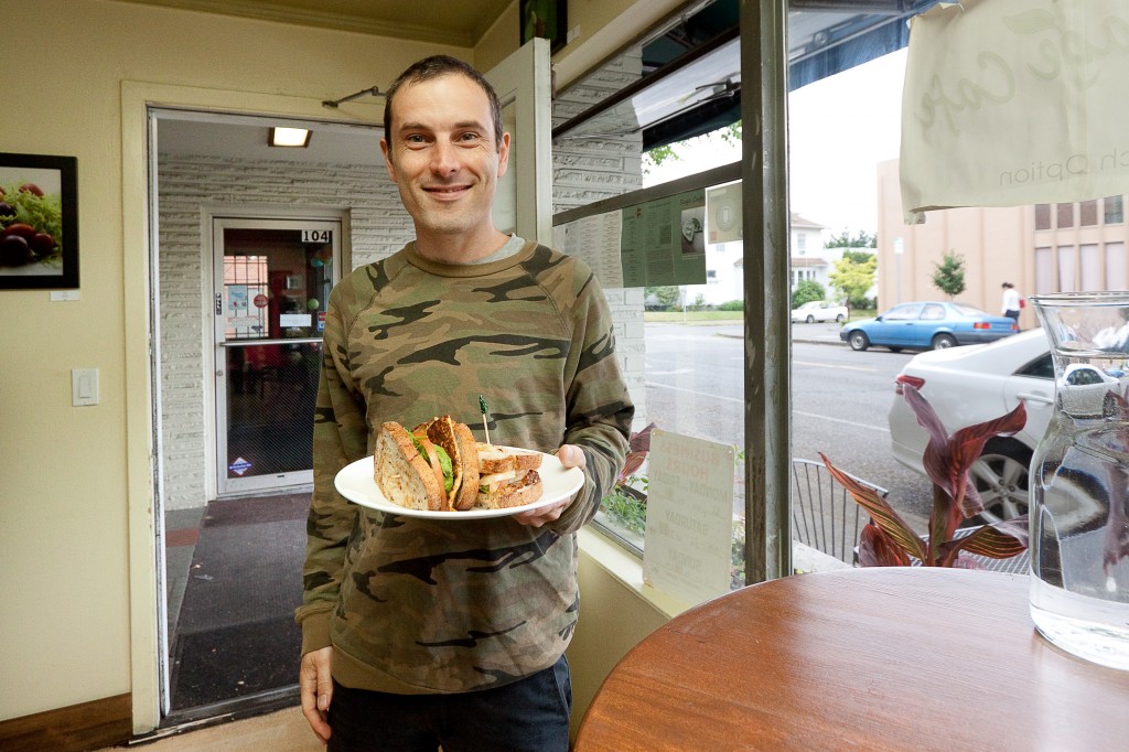 A customer with a Chipotle Grill sandwich.