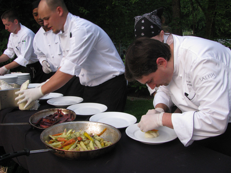 The Chef plates the main course.