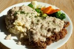 Chicken-fried steak, covered in gravy.