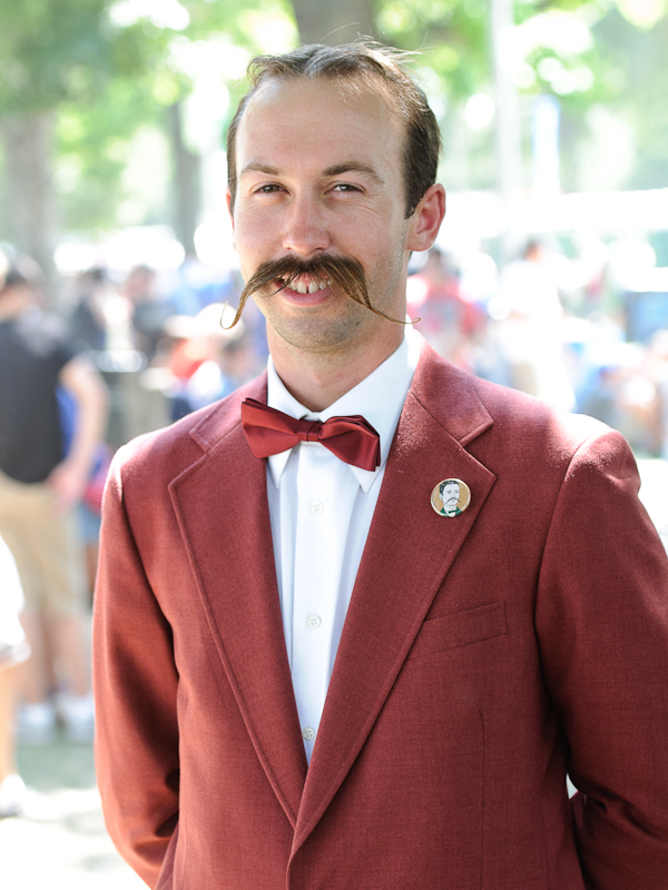 If you look closely, you may notice this man's lapel button. And you may also notice it's an illustration of himself.