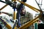 Chas Robles, an employee with Bell Town Pull Apart, fixes bicycles at the Green Festival at the Convention Center in Seattle, Wash., on Sunday, June 6, 2010.  (Photo by Matthew Williams for The Seattle Weekly)
